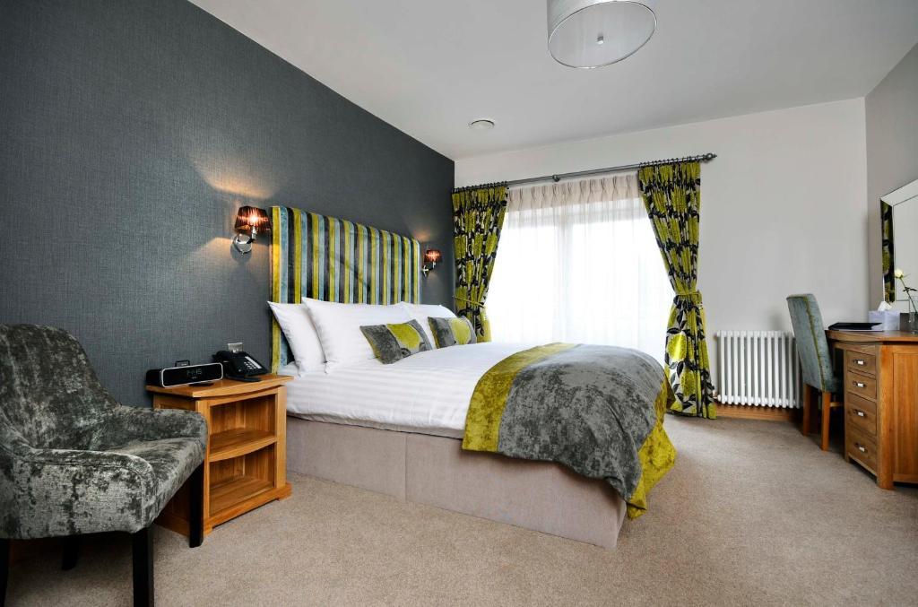 Ennios Boutique Hotel Southampton Camera foto A bedroom at the hotel